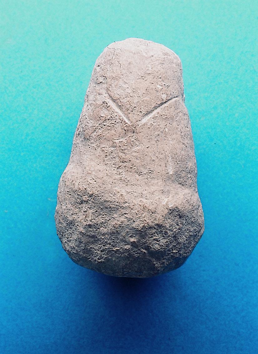 A limestone Pebble Figurine