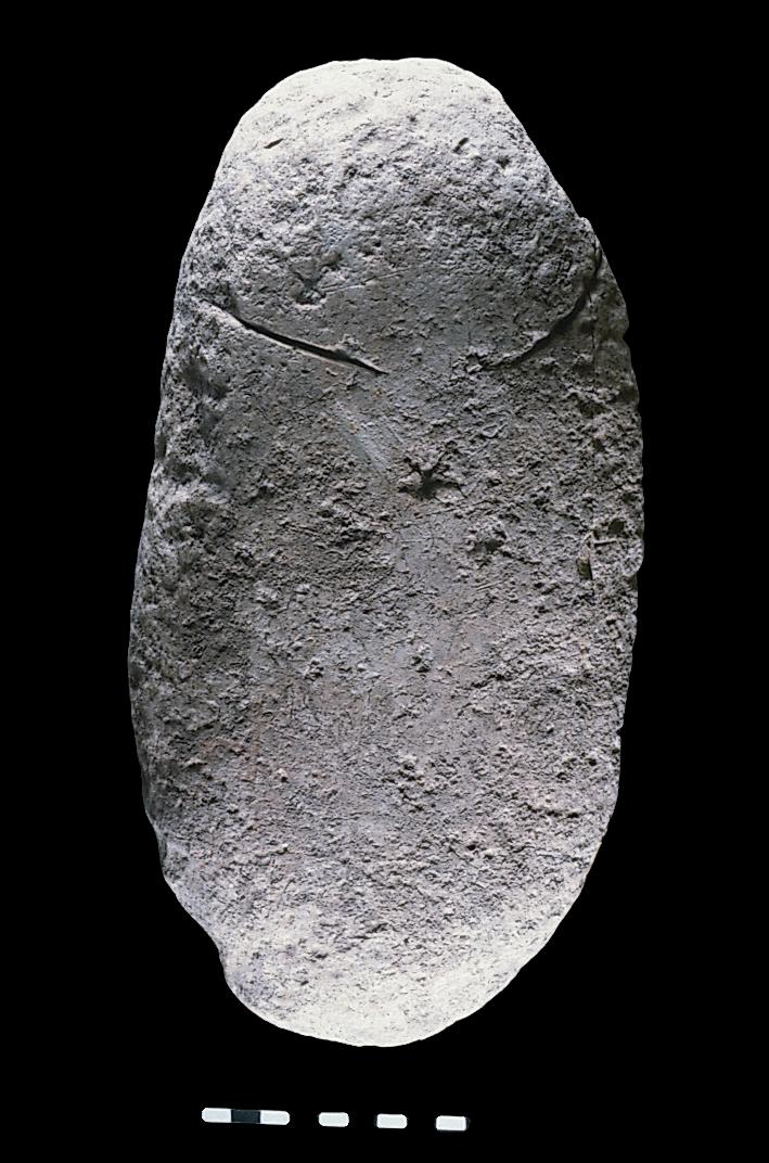 A limestone Pebble Figurine. 
